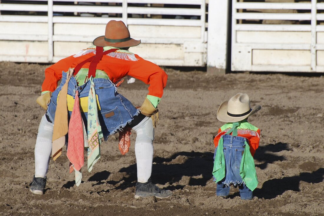 Adult & Child dressed as clowns at rodeo